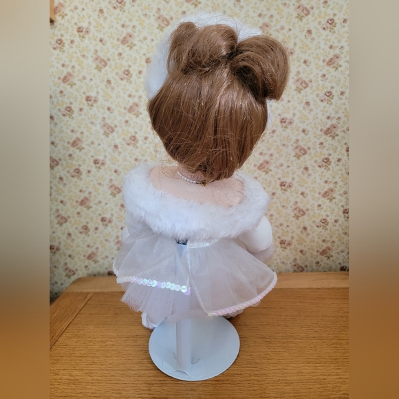 Charming Porcelain Doll with Lace Details and Rosy Cheeks - Picture 3 of 5